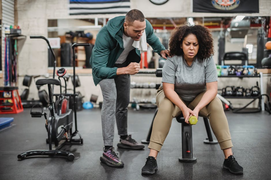 personal training session with certified trainer guiding client through workout